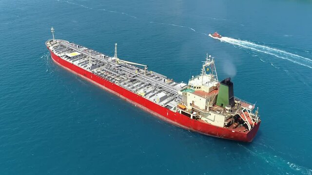 Oil chemical tanker cruising along the Turkish straits. Tracking shot of a 182 meters long tanker ship. Annually 10K tankers pass through Bosporus where it currents caused the ships to drift sideways
