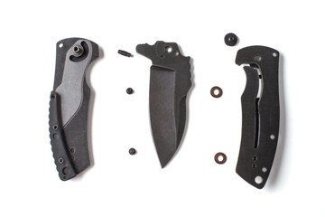 Top view on blade, handle of a disassembled knife and screws