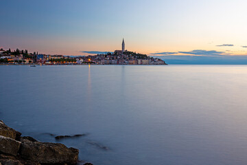 View to the historic center of Rovinj during sunset with water reflections