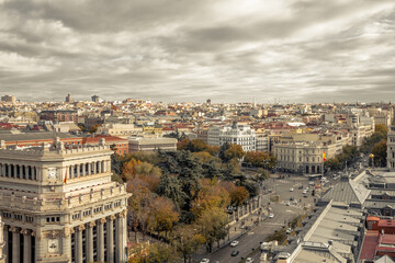 Obraz premium Looking down a wide boulevard over several buildings in urban Madrid Spain