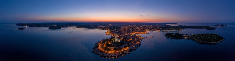 Fototapeta na wymiar Panoramic aerial drone picture of the historic city Rovinj in Croatia during sunrise