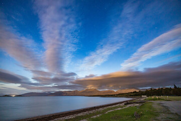 night shot of the stars and Milky Way above rannoch moor, glen etive and Glencoe in the argyll region of the highlands of Scotland during a clear bright night in autumn