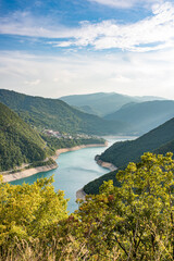 Lake Piva or Pivsko jezero artificial lake, Montenegro. View to Pluzine town from top of serpentine road.