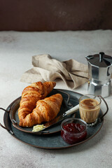 croissants with coffee and jam, tipical cotinental breakfast