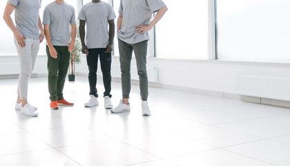 Fototapeta premium group of young people standing in an empty office.