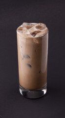 A fresh coffee cocktail with milk and ice cubes