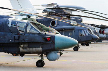 Helicopters and planes in row, military copters and reconnaissance aircrafts, air force, modern army aviation and aerospace industry
