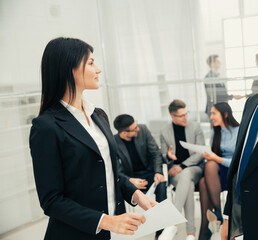 businessman and businesswoman discussing a business document