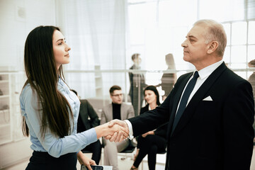 business partners greeting each other with a handshake