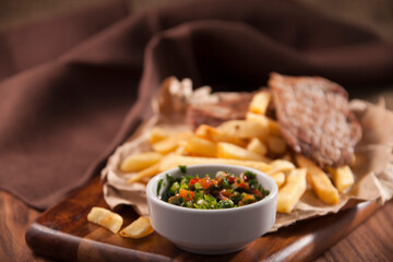 french fries with meat and salsa sauce