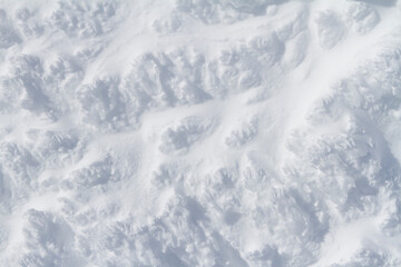 Snowy background, wind patterns on hard snow