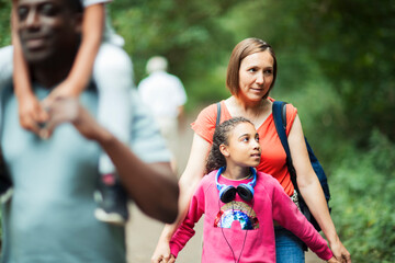 Affectionate mother daughter hiking