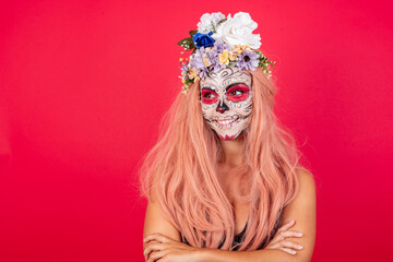 Dreamy rest relaxed caucasian young beautiful woman wearing halloween make up over red background...
