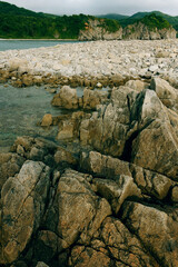 Rocky seashore, cloudy weather at sea, coastline of telyakovsky Bay Primorsky Krai, Russia.