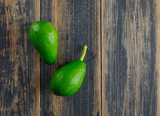 Avocados on a wooden background. flat lay.