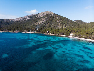 Fototapeta na wymiar Aerial drone view, beautiful scenic landscape view of mountains and blue crystal clear water on the shore of Mallorca Island, Balearic Island, Spain