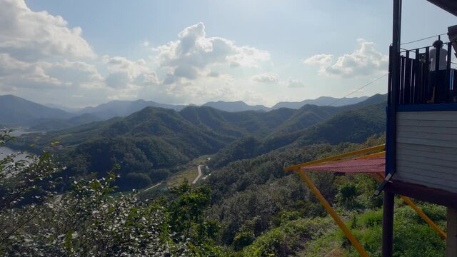 People Zip Line Quickly Into Valley Below