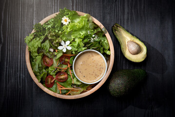 Mix vegetable salad with sauce on the table