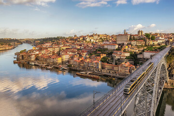 Fototapeta na wymiar Porto Portugal city skyline at Porto Ribeira and Douro River and Dom Luis I Bridge