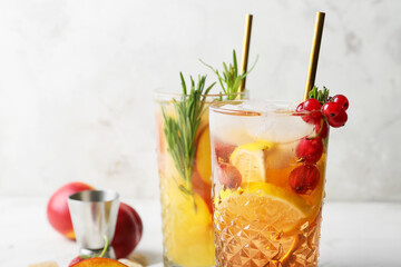 Glasses of fresh fruit mojito cocktail on table