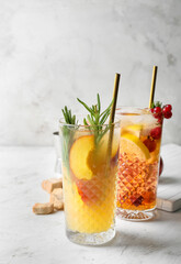Glasses of fresh fruit mojito cocktail on table