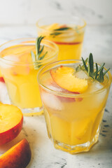 Glasses of fresh peach mojito cocktail on table