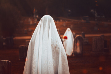 Ghosts In White Sheets Celebrating Halloween