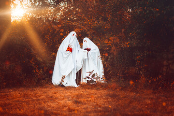 Ghosts In White Sheets Celebrating Halloween