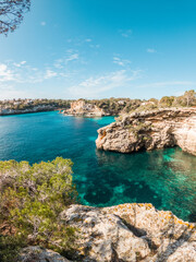 Blue water and rocks at Es Pontas - The Bridge - Natural monument in Palma de Mallorca, Balearic Islands, Spain