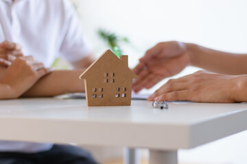 Young couple make contract for new house or apartment with agency