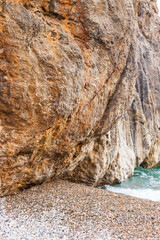 Sunny day over the rocks and the blue water in Sa Calobra, Palma de Mallorca, Balearic Islands, Spain