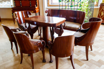 Interior of classical luxury dining room with wooden table and chairs