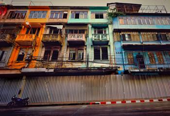 Old and derelict apartment buildings on Yaowarat Road or Chinatown in Bangkok City