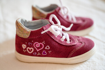 Small children's leather shoes of pink color.