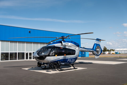 Magdeburg, Germany,  Airport Magdeburg-City an Airbus state Police Helicopter H145 is parked in front of hangar, ready for a mission 