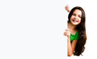 Very happy excited cute little girl in green smart casual clothing showing blank banner signboard. Success and advertising concept. Copyspace place for some text. Isolated over white background