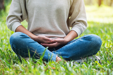 Closeup image of a woman meditating in nature