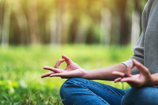 Closeup image of a woman meditating in nature