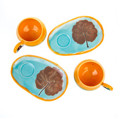 colorful ceramic coffee cups on white background isolated