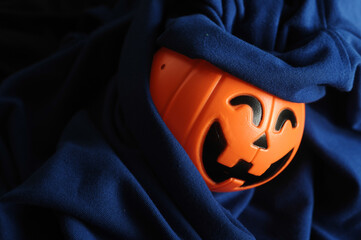 Halloween pumpkin head devil in dark cloth. Halloween Ghost Festival.