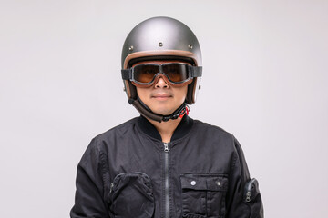 Motorcyclist or rider wearing vintage helmet. Safe ride concept. Studio shot on grey