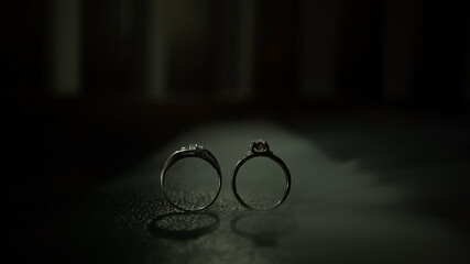 two rings in the dark background with smoke or fog