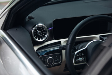 Obraz na płótnie Canvas Modern suv car interior with leather panel, multimedia and dashboard