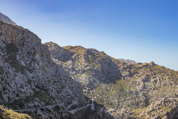 Sunny day over the rocks and the blue water in Sa Calobra, Palma de Mallorca, Balearic Islands, Spain