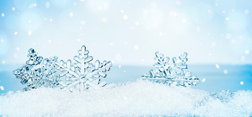 three snowflakes in the snow. winter greeting card