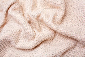 Knitted woolen bedspread background. View from above