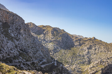 Sunny day over the rocks and the blue water in Sa Calobra, Palma de Mallorca, Balearic Islands, Spain