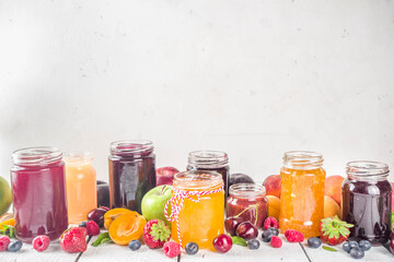 Fototapeta na wymiar Assortment of berries and fruits jams