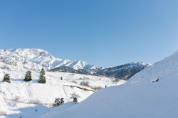 Mountain peaks of the Tien Shan covered with snow. Beldersay Resort
