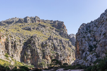 Sunny day over the rocks and the blue water in Sa Calobra, Palma de Mallorca, Balearic Islands, Spain